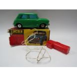 A Lincoln International green plastic remote control Mini Austin,