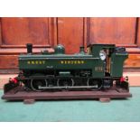 A gauge 1 live steam GWR 57XX class 0-6-0 pannier tank locomotive in green livery,