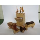 A handmade wooden working catapult and two wooden trucks with blocks