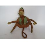 An early 20th Century soft filled felt monkey