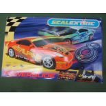 A Scalextric Powerslide set with Nissan 350Z cars