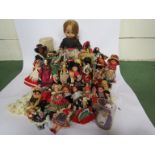 A collection of mixed costume and character dolls