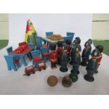 Assorted vintage wooden toys including conical tower puzzle, dolls' furniture,