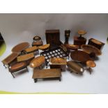 A collection of handmade wooden dolls house furniture including wardrobe, bed,