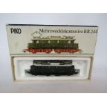 A boxed Piko HO gauge BR 244 Mehrzwecklokomotive in green livery