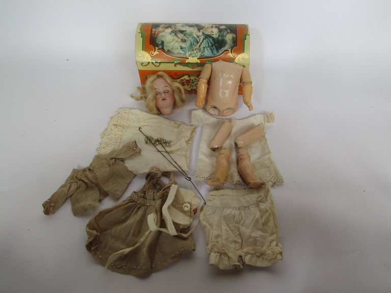 A small German bisque head girl doll with jointed composition body,