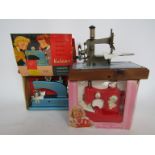 A boxed Vulcan child's sewing machine,