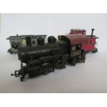 An Aristo-Craft G gauge 1201 0-6-0 locomotive and two wagons