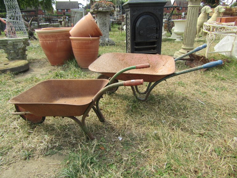 Two child's wheelbarrows