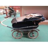 A vintage Silver Cross doll's pram