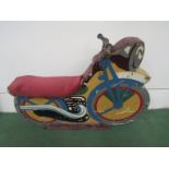 A mid 20th Century painted wooden fairground seat in the form of a motorcycle