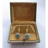 A pair of gold emerald and diamond daisy drop earrings, unmarked, 3cm drop, 4.