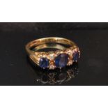 An 18ct gold diamond and sapphire ring.