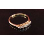 An 18ct gold platinum set graduated five stone diamond ring .30ct total approx. Size Q, 1.