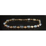 A topaz bracelet, stamped 10k, 19cm long, 5.