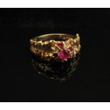 A gold ruby and diamond ring, stamped 18k. Size R, 4.