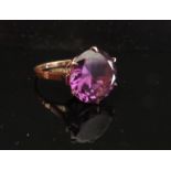 A gold ring with single alexandrite 12mm diameter, marks rubbed. Size L, 3.