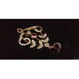 An Edwardian garnet and seed pearl pendant marked 9ct, 4cm drop, 1.