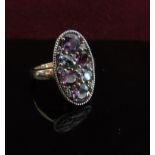 A 9ct gold oval cluster ring. Size N/O, 3.