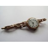 A 9ct gold cased lady's wristwatch, case dented. 19.
