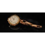 A 9ct gold cased lady's wristwatch, dented, 19.