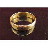 A 22ct gold wedding band, 5mm wide. Size Z, 4.