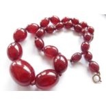 A cherry amber necklace, 47cm long, 47.