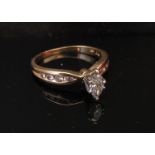 A gold marquise cut diamond ring .48ct approx with diamonds set shoulders.