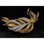 An 18ct two tone gold Kutchinsky brooch, each white gold frond set with brilliant cut diamonds, 3.