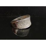 A 9ct white gold pave set diamond ring. Size Q/R, 3.