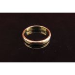 A gold wedding band, unmarked, 2.5mm wide. Size H/I, 2.