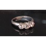 A platinum three stone diamond ring .80ct total approx. Size J, 3.