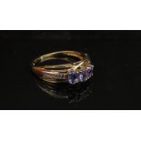 A 14ct gold tanzanite and diamond ring. Size P/Q, 2.