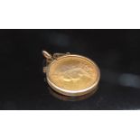 An 1889 gold sovereign in loose pendant mount, 9.