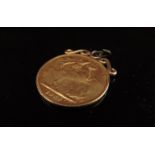 An 1887 gold sovereign on pendant mount, worn, 8.