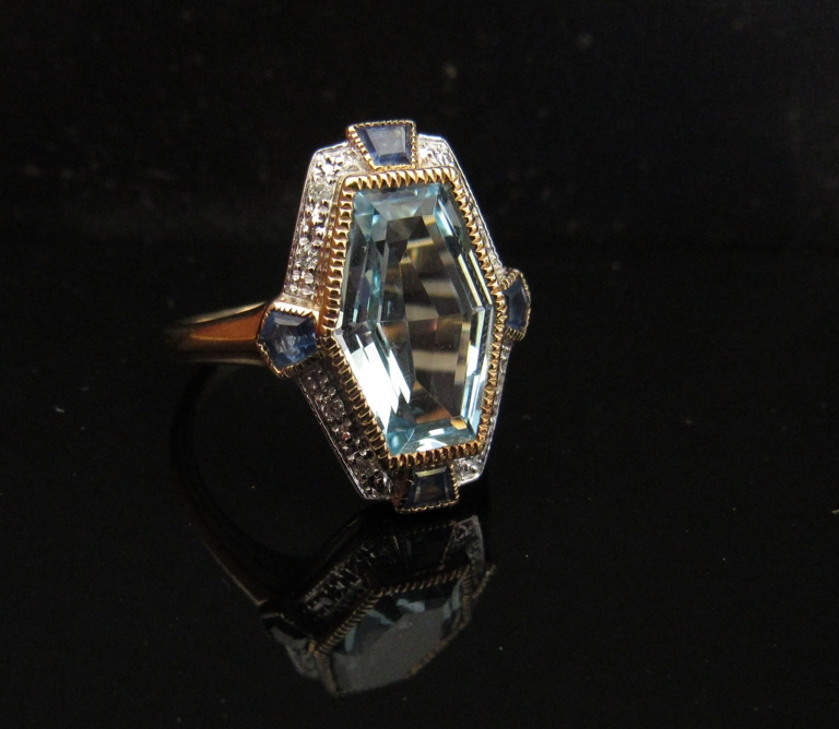 A 9ct gold aquamarine, sapphire and diamond chip ring. Size M/N, 4.