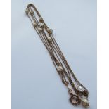 A 9ct gold opera length necklace set with natural pearls, 146cm long,