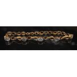 A 9ct gold topaz bracelet, 18cm long, 5.