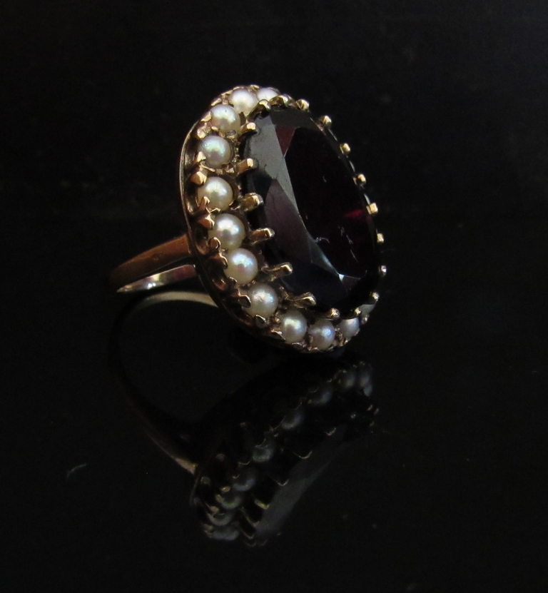 A 9ct gold garnet (18mm x 14mm) and seed pearl ring. Size N, 9. - Image 2 of 2