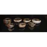 Six 9ct gold rings (one unmarked) and a 9ct gold locket,
