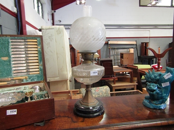 A Victorian "Duplex" oil lamp with etched floral shade and glass reservoir