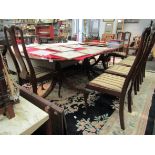 A reproduction Regency style mahogany three pedestal D-end dining table,