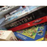 A box of vintage games incliding Mastermind and jigsaws