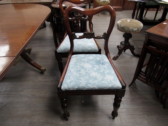 A set of six Victorian balloon back chairs with blue upholstered drop in seats