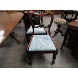 A set of six Victorian balloon back chairs with blue upholstered drop in seats