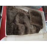 A fur stole in an original Bourne and Hollingsworth retail box