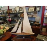 A model pond yacht on stand