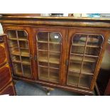 A Queen Anne style walnut early 20th Century china display cabinet of three doors