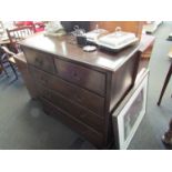 A George III style oak chest of two short over three graduating long drawers on bracket feet,