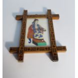 A Tunbridge ware frame with oriental rice paper image of seated figure, 9.